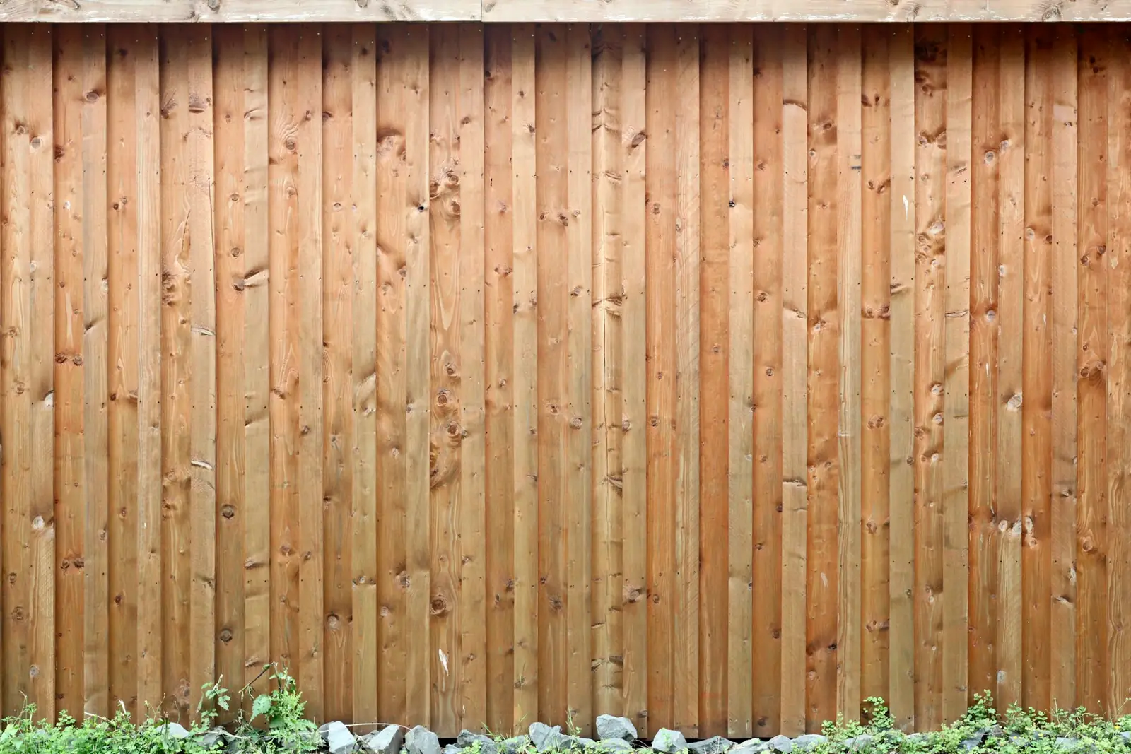 Closeboard fence made from vertical feather edge boards