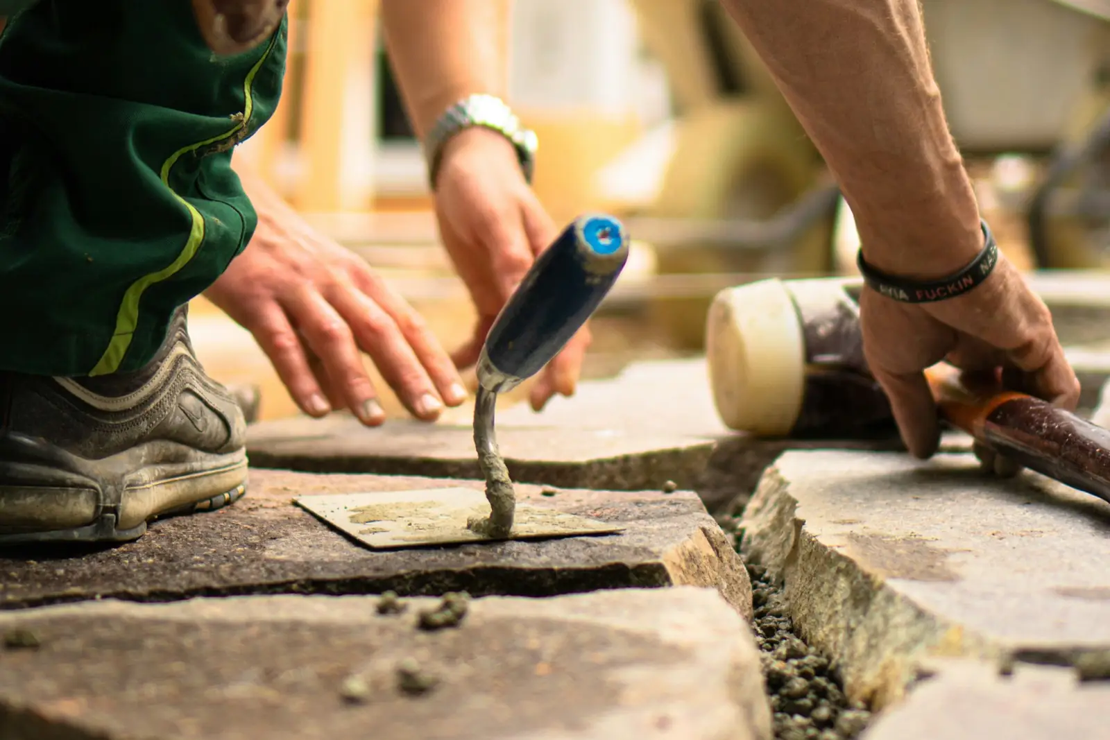 Builder pointing a new section of masonry