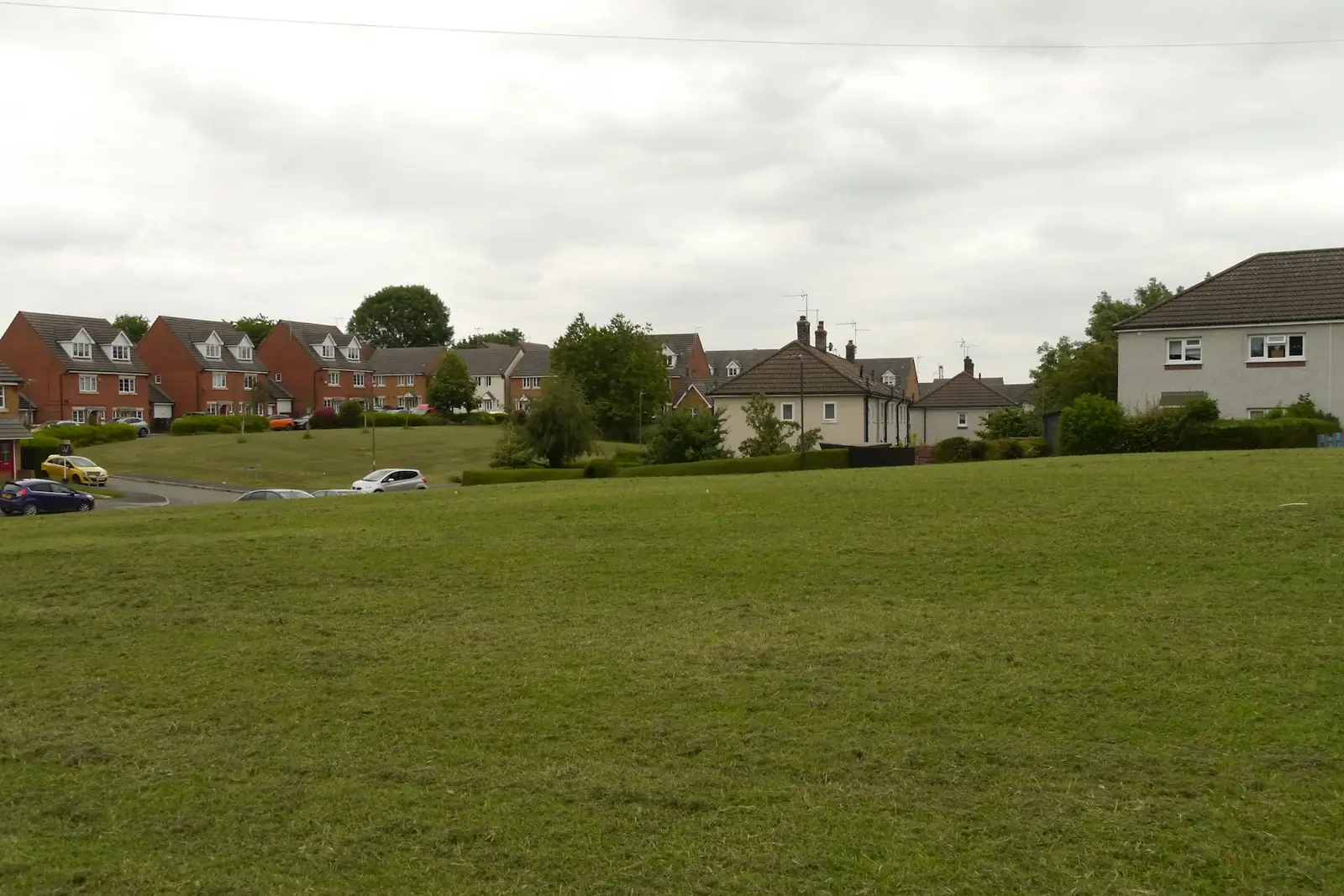 Green open space beside a residential housing estate