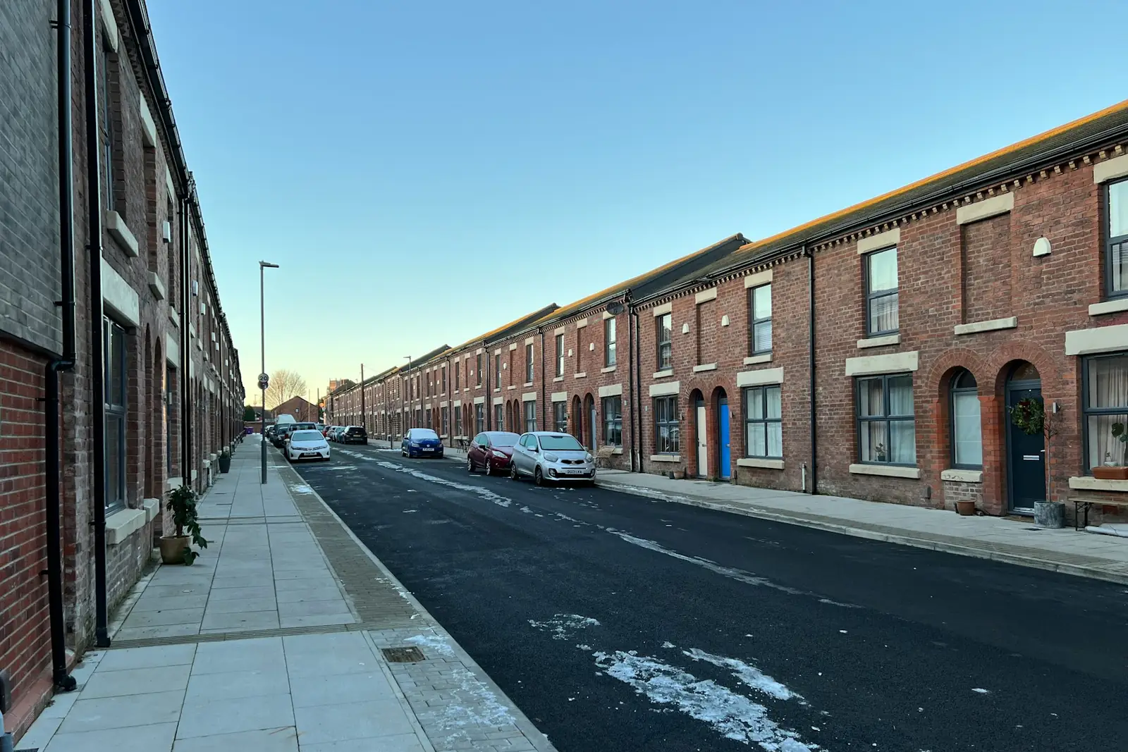 Long street of red-brick terraced houses