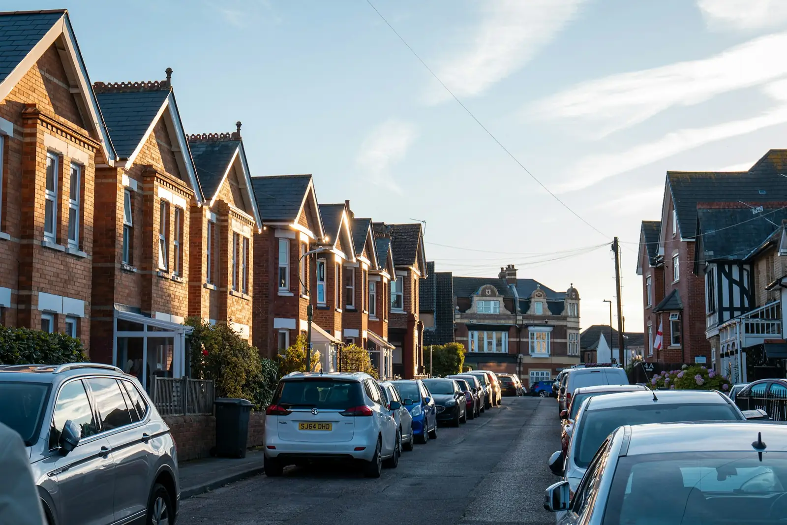 Victorian terraced houses with bay windows on a residential street